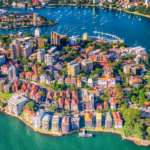 The many colourful apartments in Northern Sydney scattered over the land between the ocean areas,